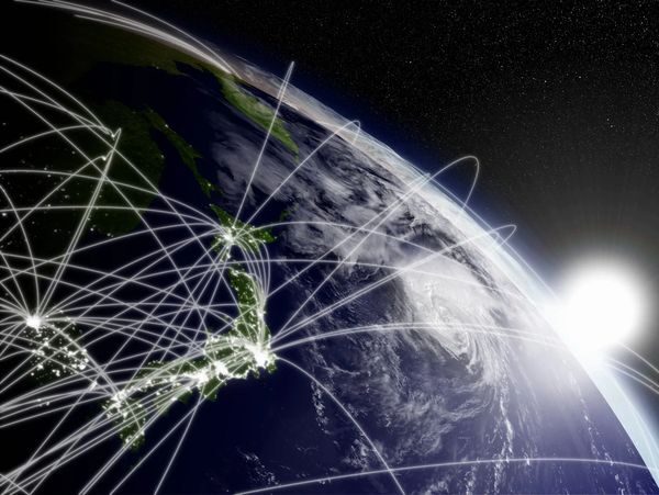 Earth with glowing network lines at sunrise.