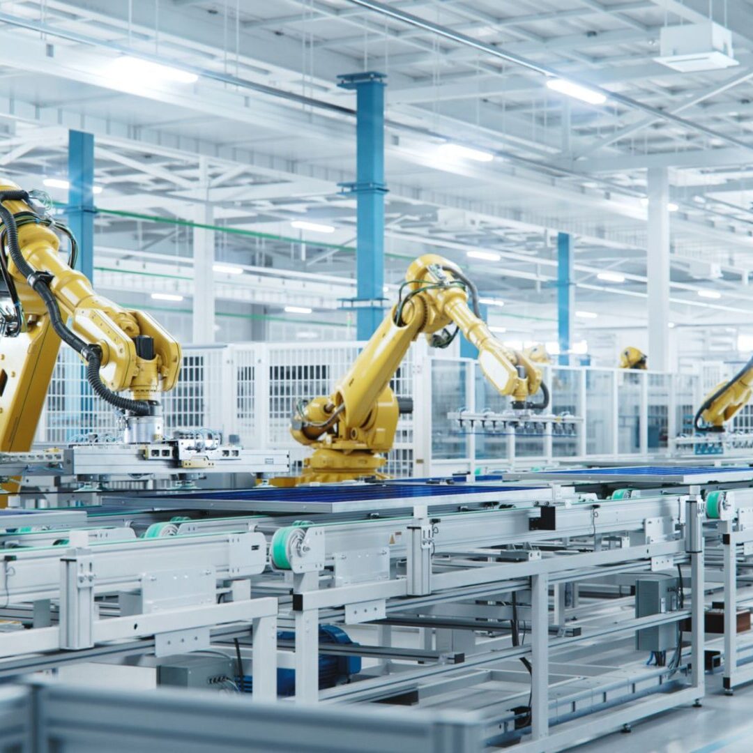 Robotic arms in a modern factory setting.